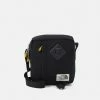 The North Face BERKELEY CROSSBODY UNISEX - Across Body Bag - Black/mineral Gold